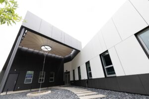 Lightweight tulip canopy over office entrance