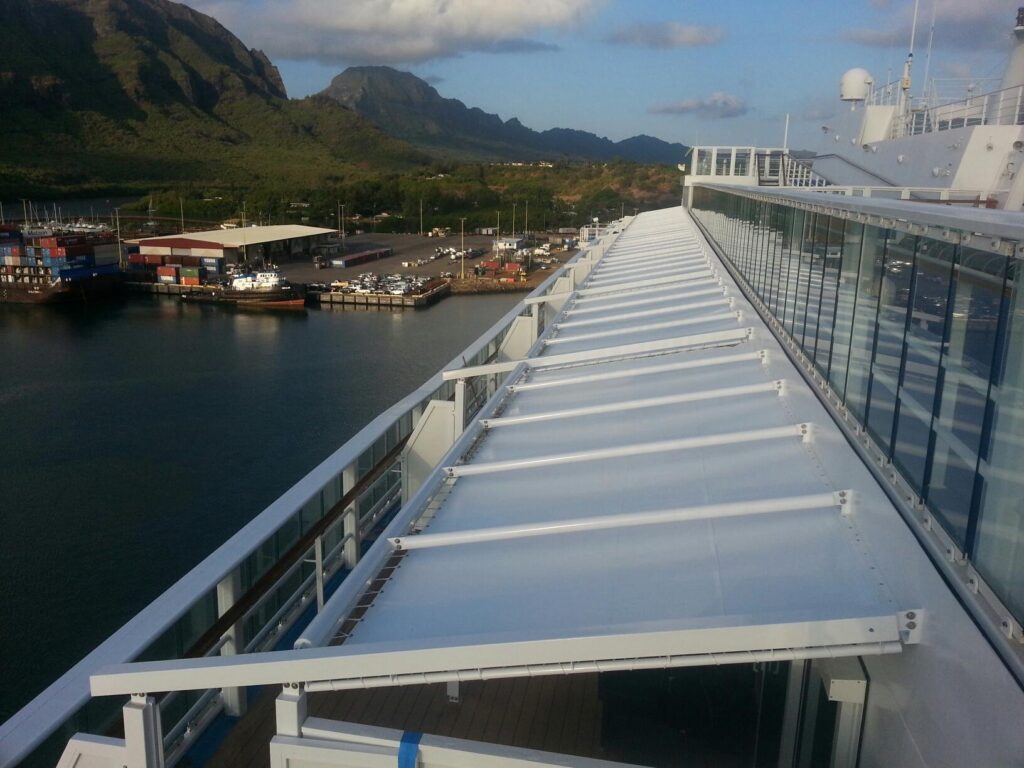 Fabric canopy on a steel frame along the upper deck of a ship