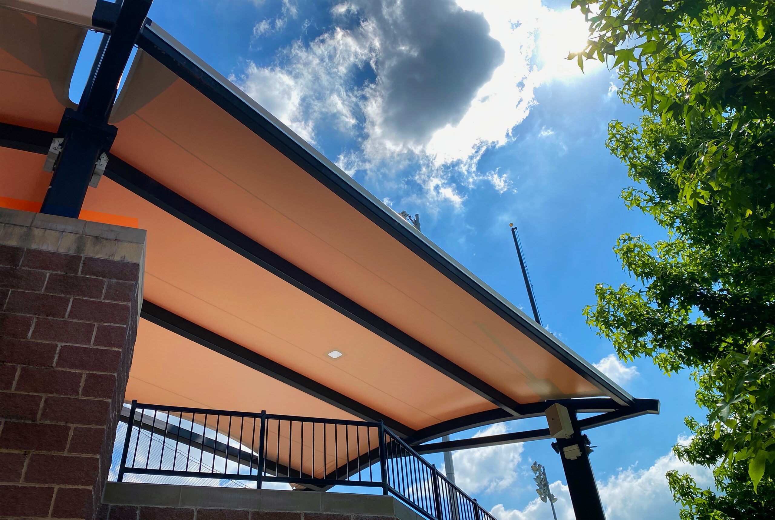 Cantilevered fabric canopy over a walkway