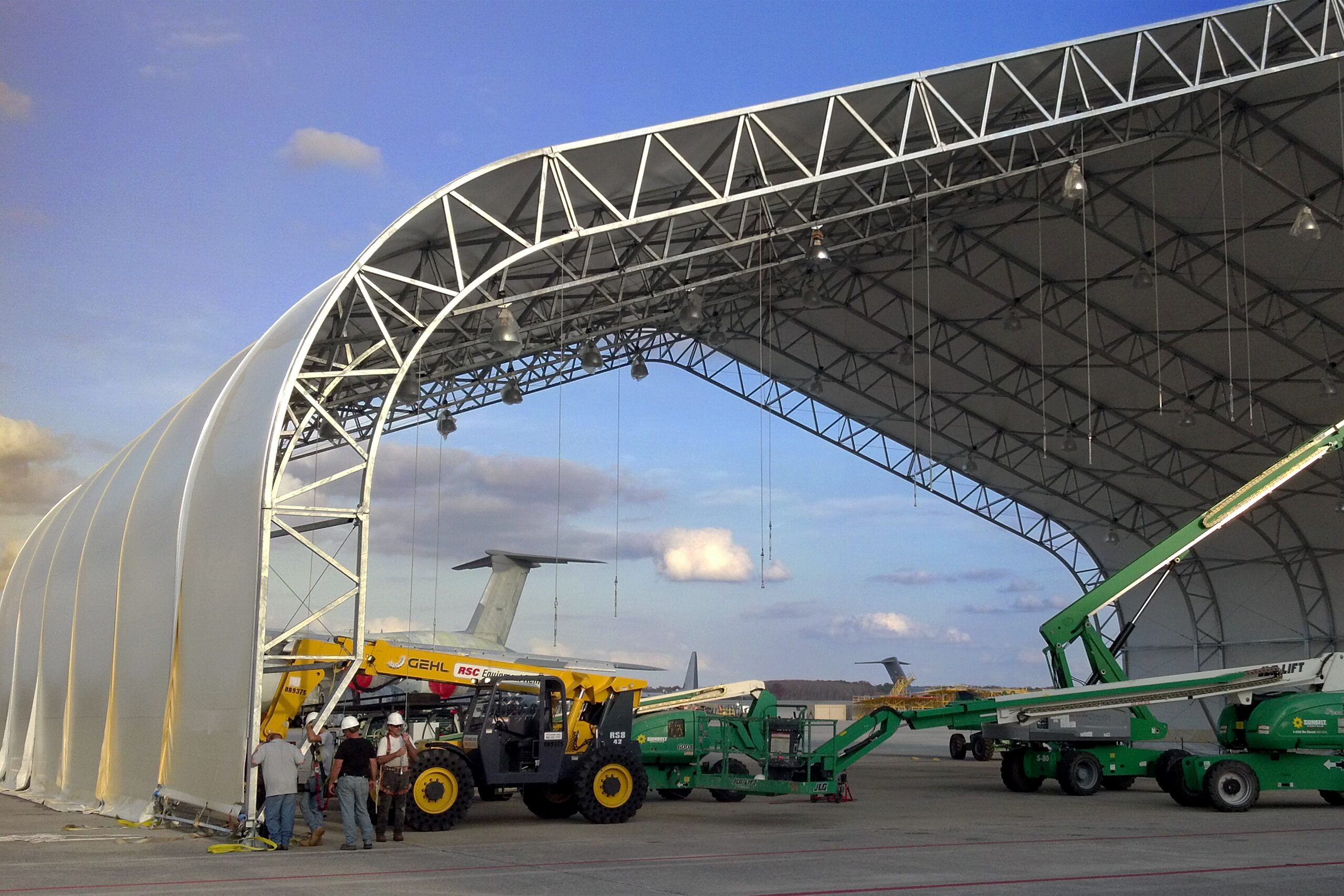Clearspan fabric building under construction with lifts in place