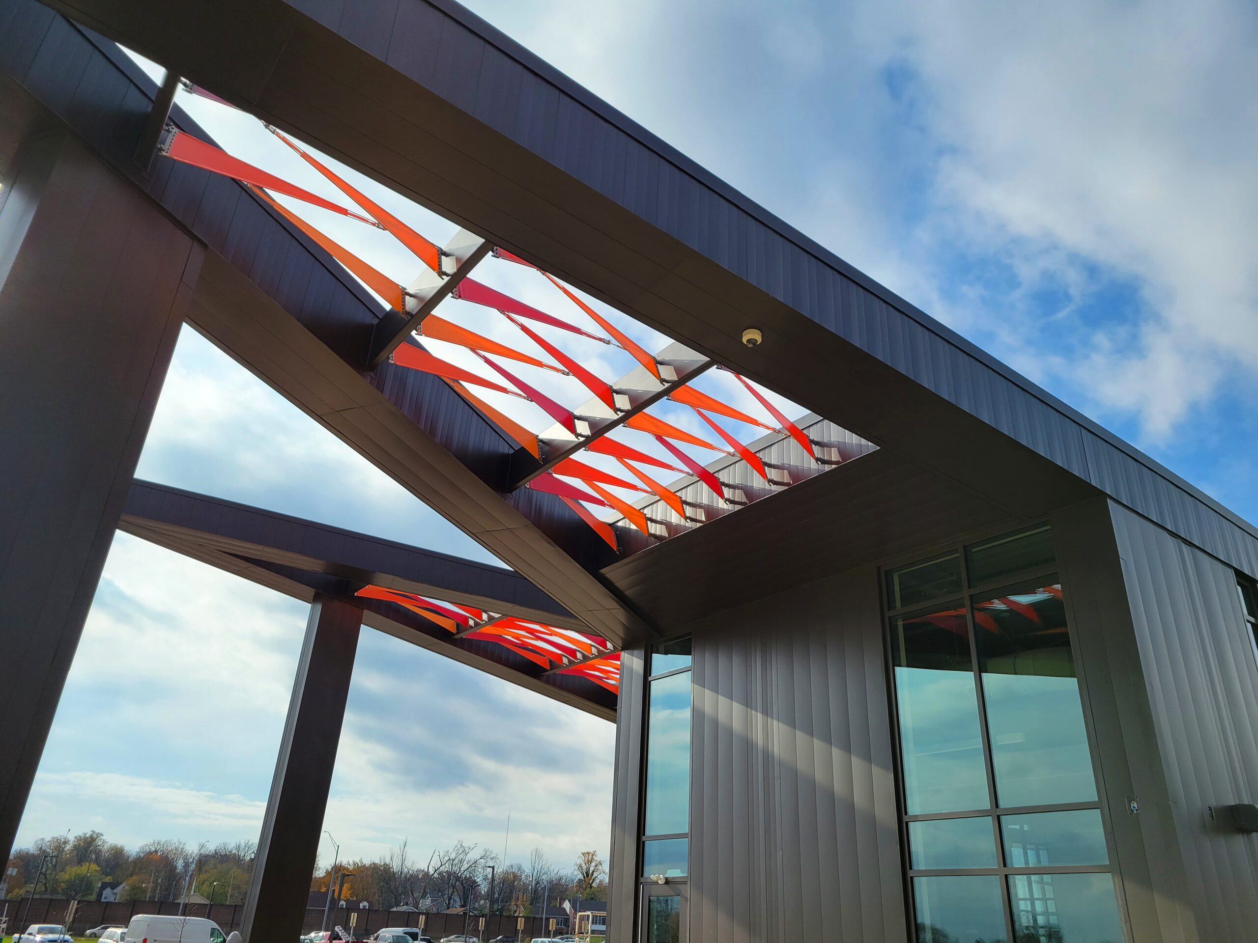 Angular fabric entrance canopy carried on a steel frame