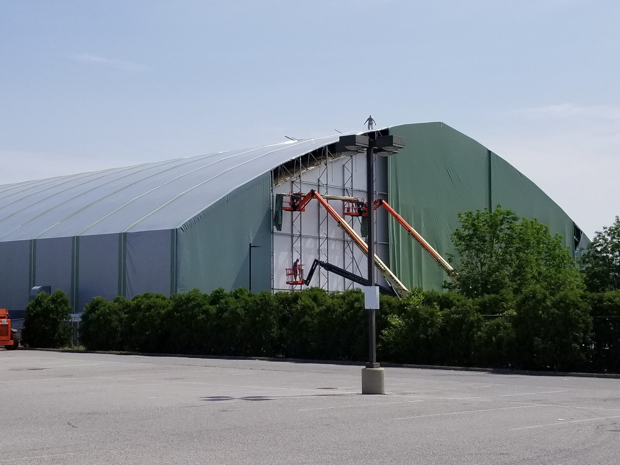 Fabric structure part way through a reskin, lift positioned at the wall